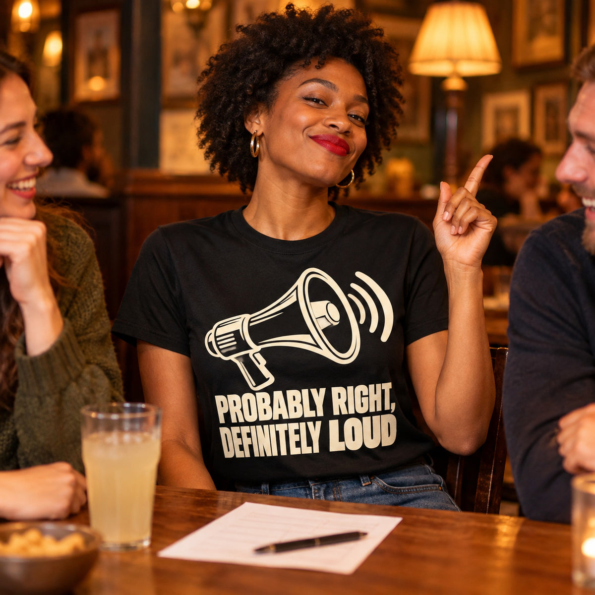Woman wearing the Minimal Line design black t-shirt at a pub quiz table