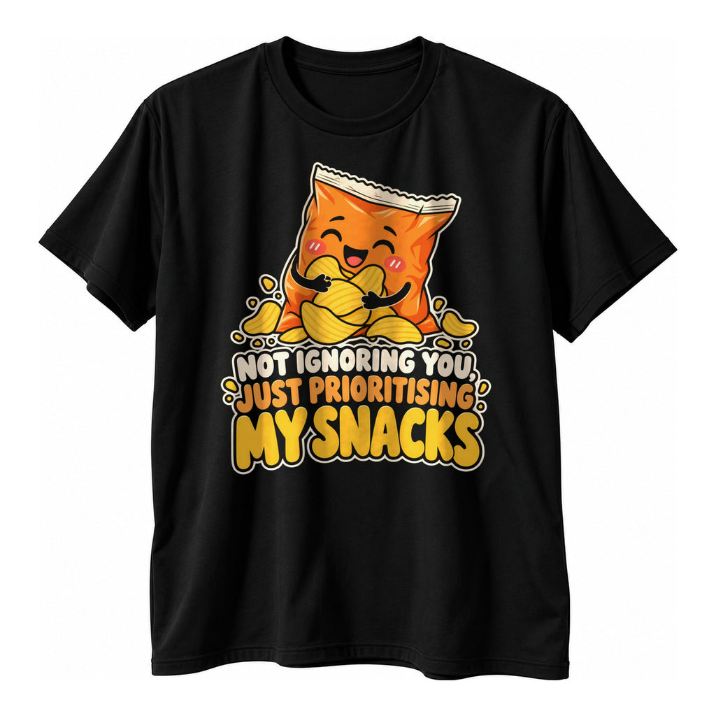 Black t-shirt with a smiling orange crisp packet hugging crisps above the text Not Ignoring You, Just Prioritising My Snacks in cream, orange and yellow
