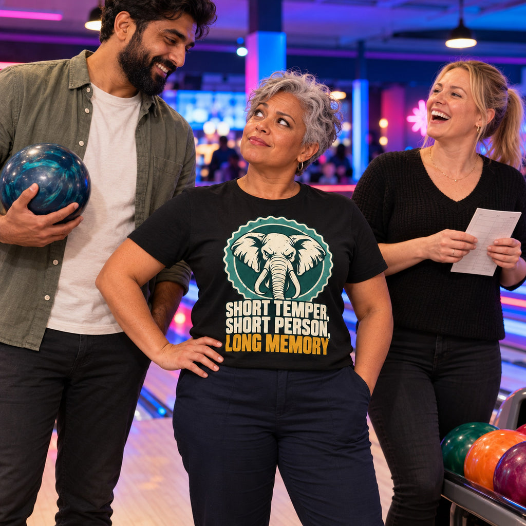 Colleagues at a bowling alley, woman wearing the Retro Stamp design black t-shirt
