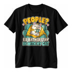 Black t-shirt with a smiling cat in a yellow blanket holding a mug on a teal sofa above the text People I'd Rather Stay In With My Cat