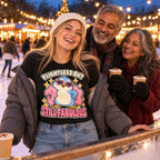 Family at an outdoor ice rink at a Christmas market, daughter wearing the Boa Penguin design black t-shirt