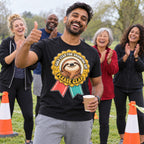 Friends cheering at a park run finish, man in front wearing the Medal Sloth design black t-shirt