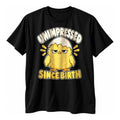 Black t-shirt with a fluffy yellow chick wearing half an eggshell as a hat above the text Unimpressed Since Birth