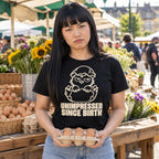Woman wearing the Line Chick design black t-shirt at a farmers market stall holding a box of eggs