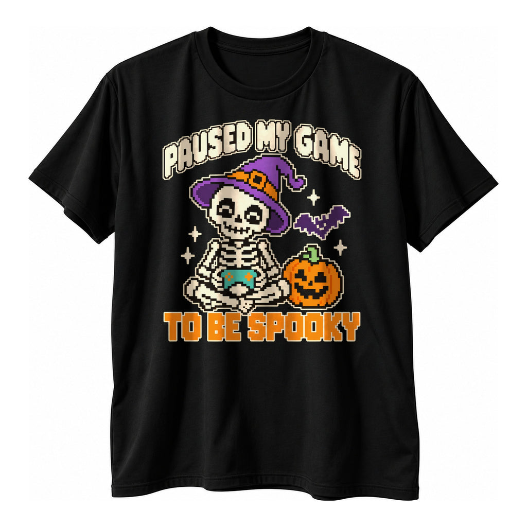 Black t-shirt with a pixel art skeleton holding a controller beside a jack o lantern above the text Paused My Game To Be Spooky