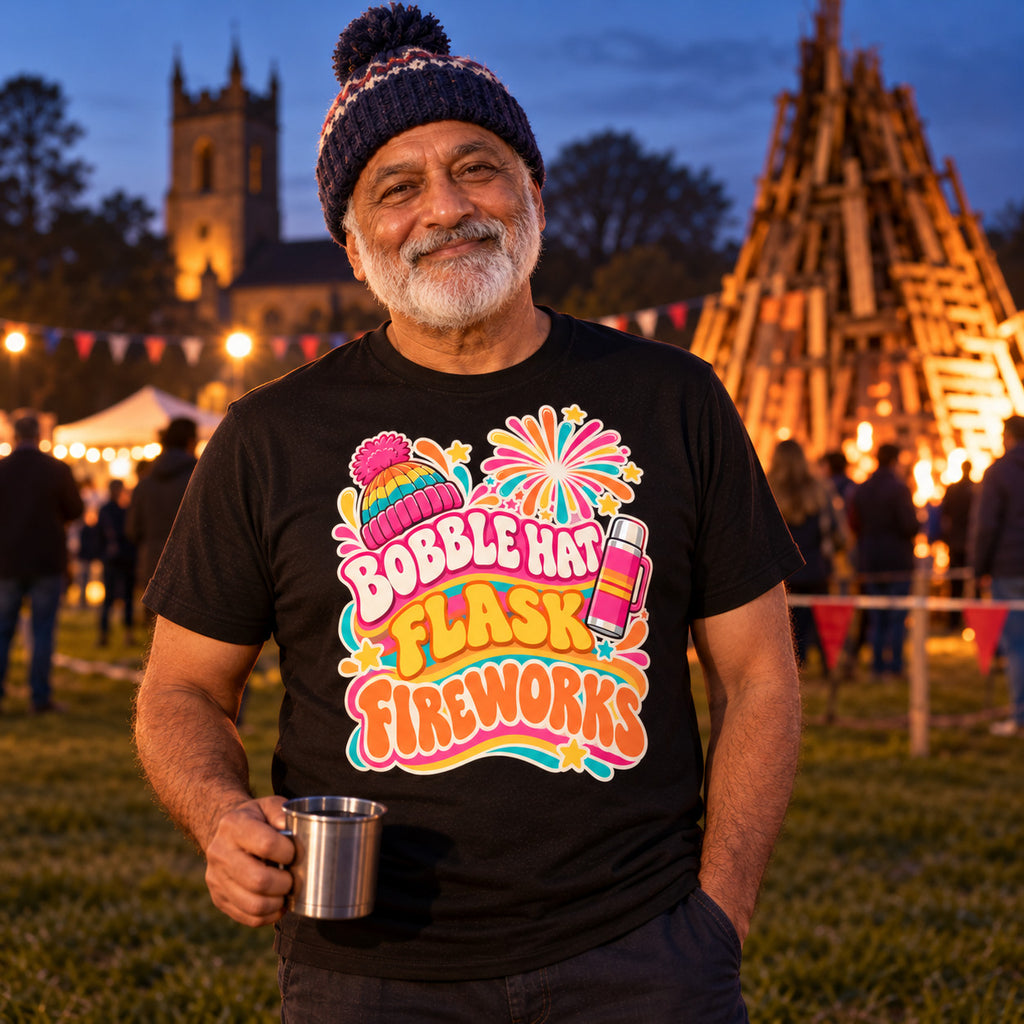 Man wearing the Groovy Wavy Trio design black t-shirt on a village green at dusk holding a flask cup of tea