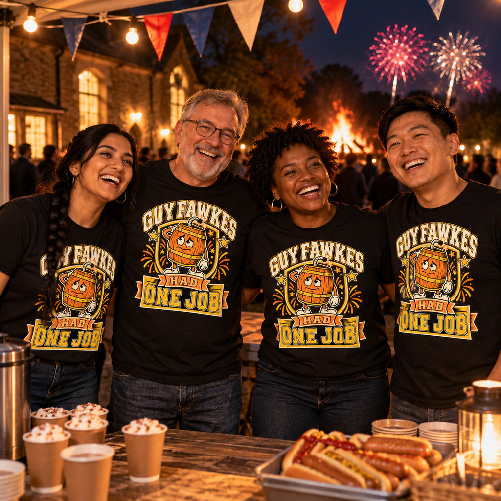 Four colleagues wearing matching Pixel Barrel design black t-shirts at a village hall fireworks fundraiser stall with a bonfire behind