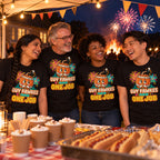 Four colleagues wearing matching Varsity Barrel design black t-shirts at a village hall fireworks fundraiser stall with a bonfire behind