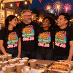 Four colleagues wearing matching Splash Barrel design black t-shirts at a village hall fireworks fundraiser stall with a bonfire behind