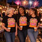 Gran, mum and teenage granddaughter wearing matching Groovy Wheel design black t-shirts at a street party with bunting and fireworks overhead