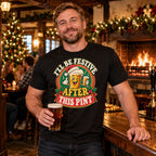 Man wearing the Pub Badge design black t-shirt at the bar of a cosy British village pub at Christmas with an open fire