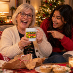 White mug with a yellow hazard warning sign reading My Secret Santa Panic Bought This, lifestyle photo 3