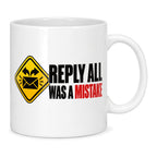White mug with a yellow warning sign, black envelope and bold black and red text reading Reply All Was A Mistake