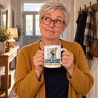 White mug with an open door, a puzzled cartoon man in pyjamas, a mustard question mark and navy lettering reading I Came In Here For Something. No Idea What., lifestyle photo 1