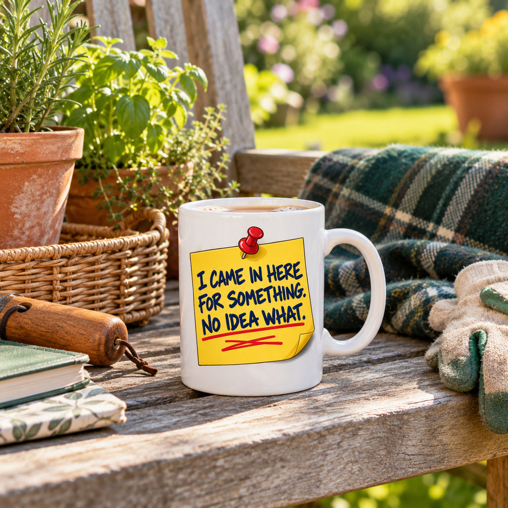 White mug with a yellow sticky note, red pin and navy marker text reading I Came In Here For Something. No Idea What., lifestyle photo 2