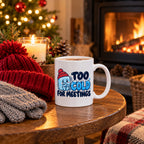 White mug with a shivering ice cube character in a red bobble hat and navy and blue lettering reading Too Cold For Meetings., lifestyle photo 2